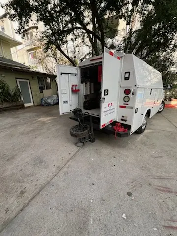 Magnet Plumbing service vehicle on-site for Grease Trap Cleaning in South Houston